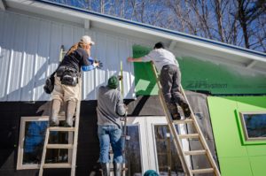 Certified contractors putting up siding 