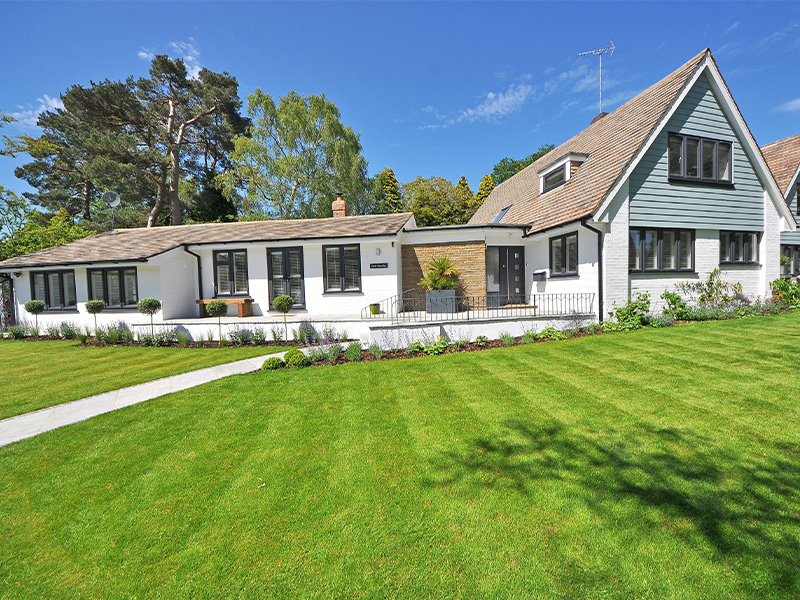 residential roof with asphalt shingles and white siding