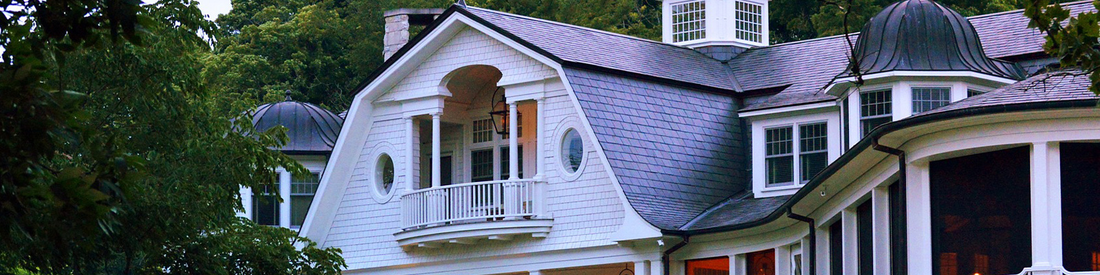 white home with residential roof replacements
