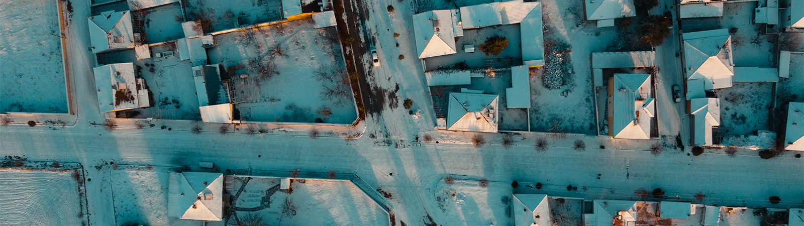 aerial view of a neighborhood during the winter